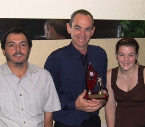 North West bowling trophy winner Pat Taylor is flanked by captain Danny Terzini and daughter Jessica - also a Moonee Valley player.